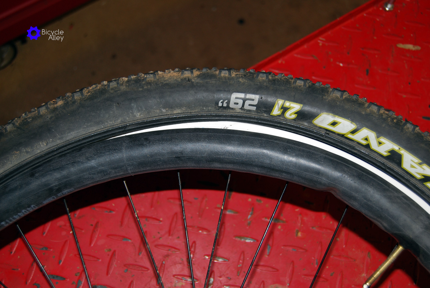 Remove tube from tire and rim